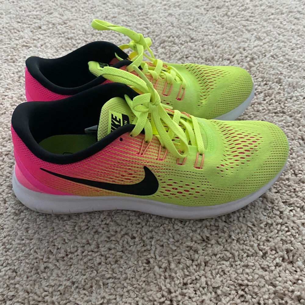 Nike neon pink and yellow running shoes, size 7.5
